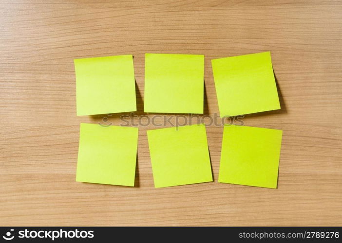 Many reminder notes on the wooden background