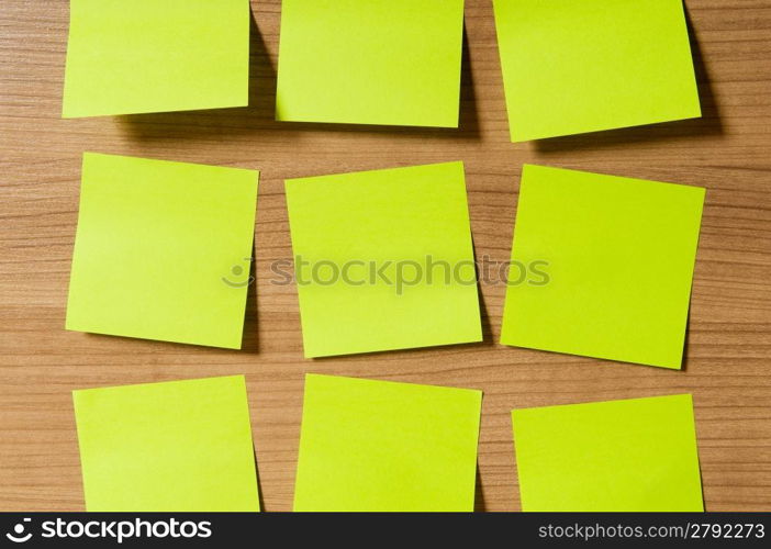 Many reminder notes on the wooden background