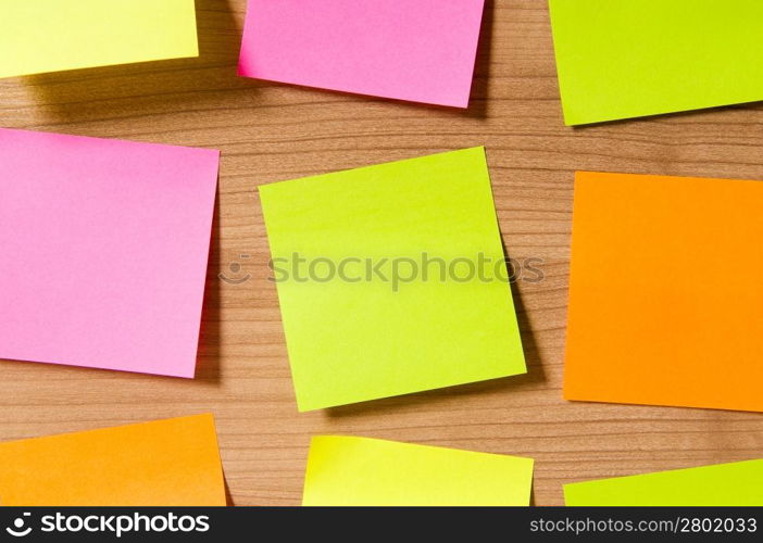 Many reminder notes on the wooden background