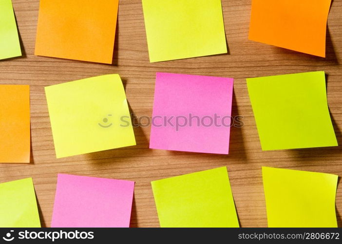 Many reminder notes on the wooden background