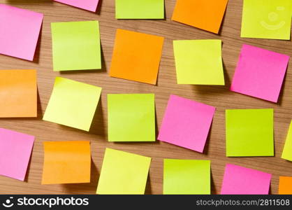 Many reminder notes on the wooden background