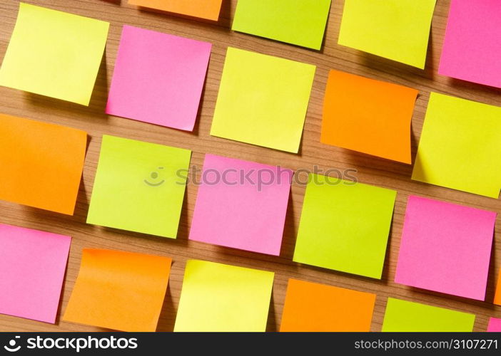 Many reminder notes on the wooden background