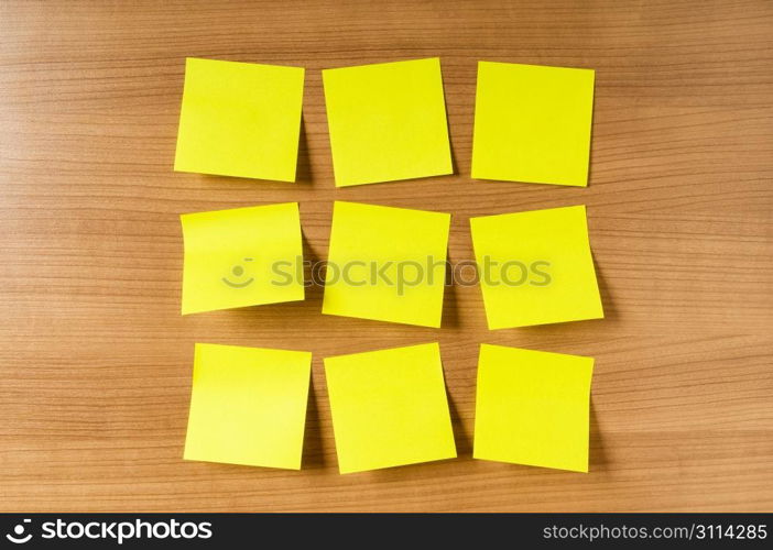 Many reminder notes on the wooden background