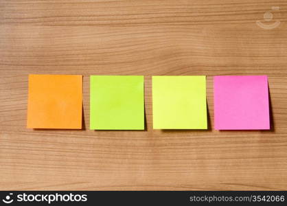 Many reminder notes on the wooden background