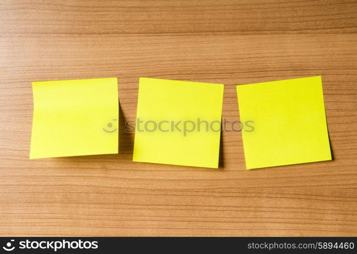 Many reminder notes on the wooden background