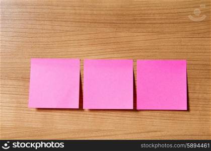 Many reminder notes on the wooden background