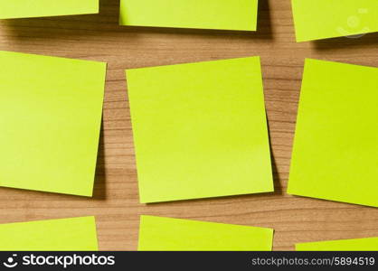 Many reminder notes on the wooden background