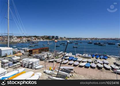 Many sailing boats in the yacht club dry land storage area, in Cascais Bay, Portugal