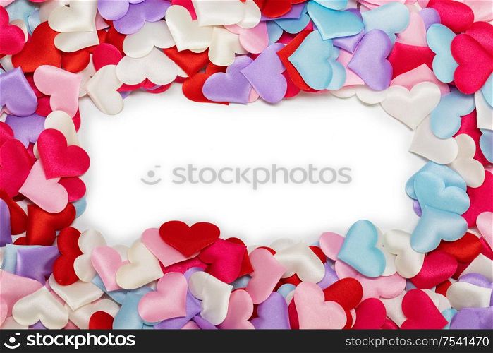 Many satin colorful hearts border frame background. St Valentines Day. Congratulations card on Valentine Day. Many satin hearts background