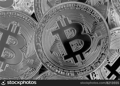 Many silver bitcoins. Cryptocurrency and virtual money concept. Shiny coins with bitcoin symbol. Flat lay top view. Macro. Many silver bitcoins. Cryptocurrency and virtual money concept