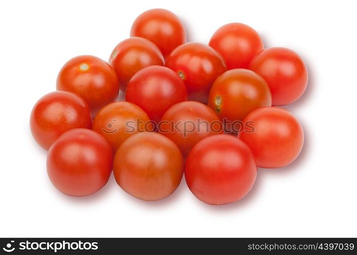 Many small tomatoes isolated on white background