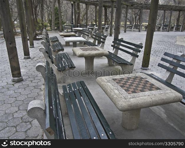 many tables with chess boards in Central Park