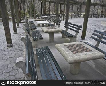 many tables with chess boards in Central Park
