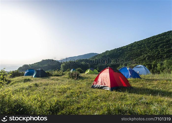 Many tents in the mountain.. Outdoor concept. Sunshine morning in the forest.