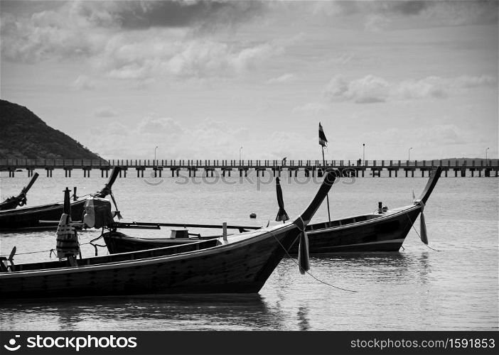Many Thailand colourful longtail fishing boat Chalong bay during monsoon season in Phuket. Black and White