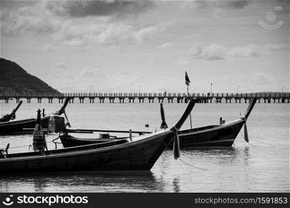 Many Thailand colourful longtail fishing boat Chalong bay during monsoon season in Phuket. Black and White