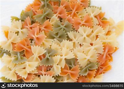 Many ties of colored pasta. Delicious carbohydrate