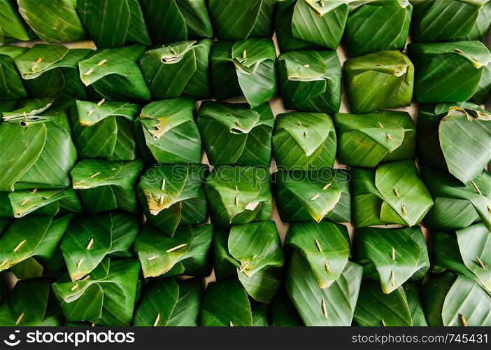 Many traditional Thai banana leaf wrapped dessert top view detail - Environmaental friendly food packaging