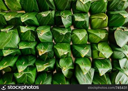 Many traditional Thai banana leaf wrapped dessert top view detail - Environmaental friendly food packaging