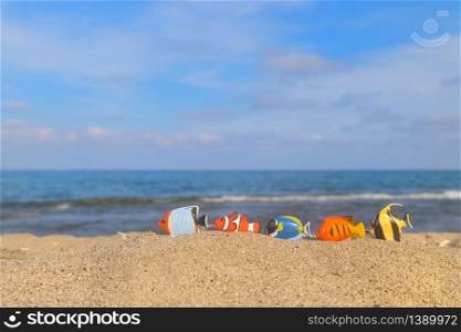 Many tropical fishes at the summer beach