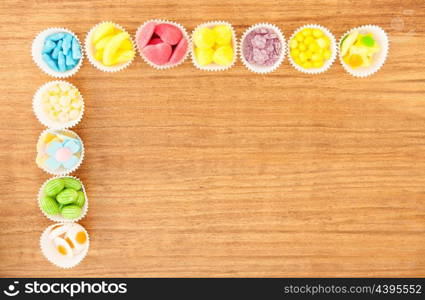 Many types of candies placed in small bowls by type and color&#xA;