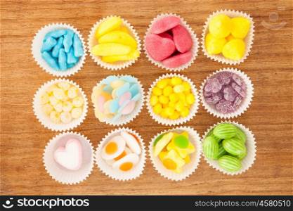 Many types of candies placed in small bowls by type and color&#xA;
