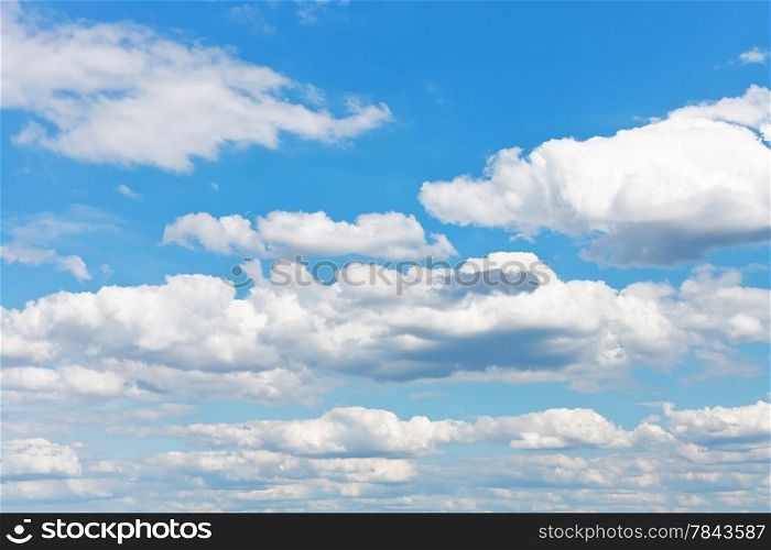 many white fluffy clouds in blue sky