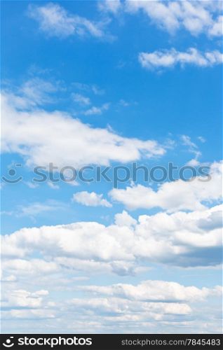 many white puffy clouds in blue sky