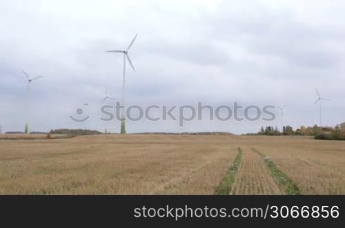 Many wind turbines in the field. Green energy.