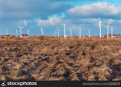 many wind turbines in the field, white wind power plants. white wind power plants, many wind turbines in the field