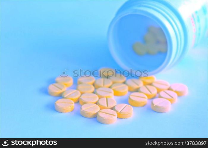 Many yellow medicine in blue tone background