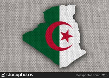 Map and flag of Algeria on old linen