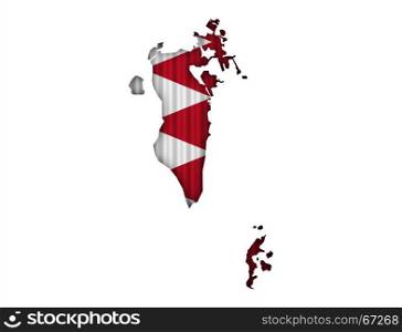 Map and flag of Bahrain on corrugated iron