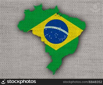 Map and flag of Brazil on old linen