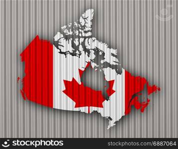 Map and flag of Canada on corrugated iron