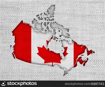 Map and flag of Canada on old linen