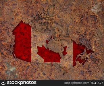 Map and flag of Canada on rusty metal
