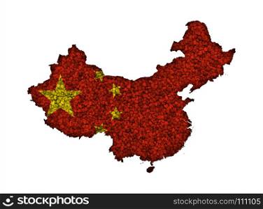 Map and flag of China on poppy seeds