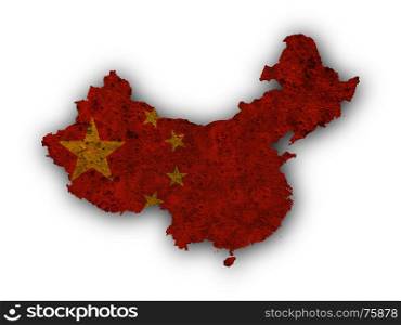 Map and flag of China on rusty metal