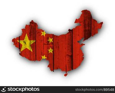 Map and flag of China on weathered wood