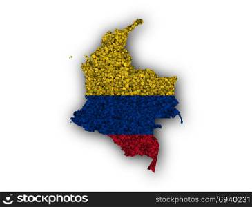 Map and flag of Colombia on poppy seeds