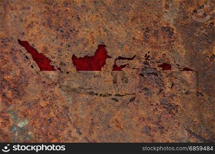 Map and flag of Indonesia on rusty metal