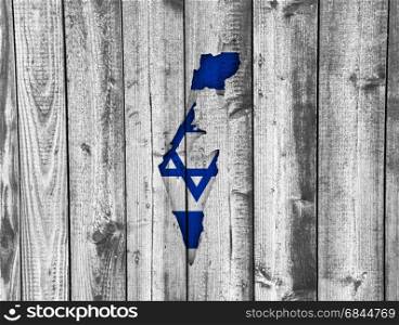 Map and flag of Israel on weathered wood