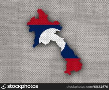Map and flag of Laos on old linen