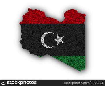 Map and flag of Libya on poppy seeds