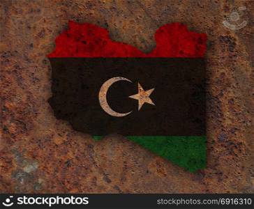 Map and flag of Libya on rusty metal