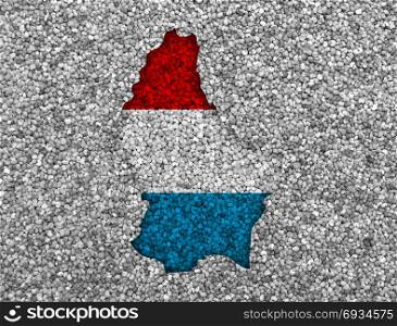 Map and flag of Luxembourg on poppy seeds