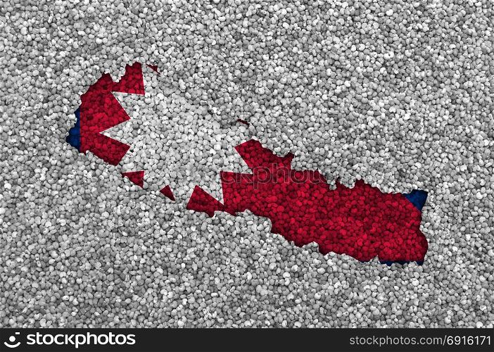 Map and flag of Nepal on poppy seeds