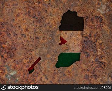Map and flag of Palestine on rusty metal