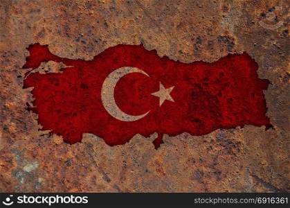 Map and flag of Turkey on rusty metal